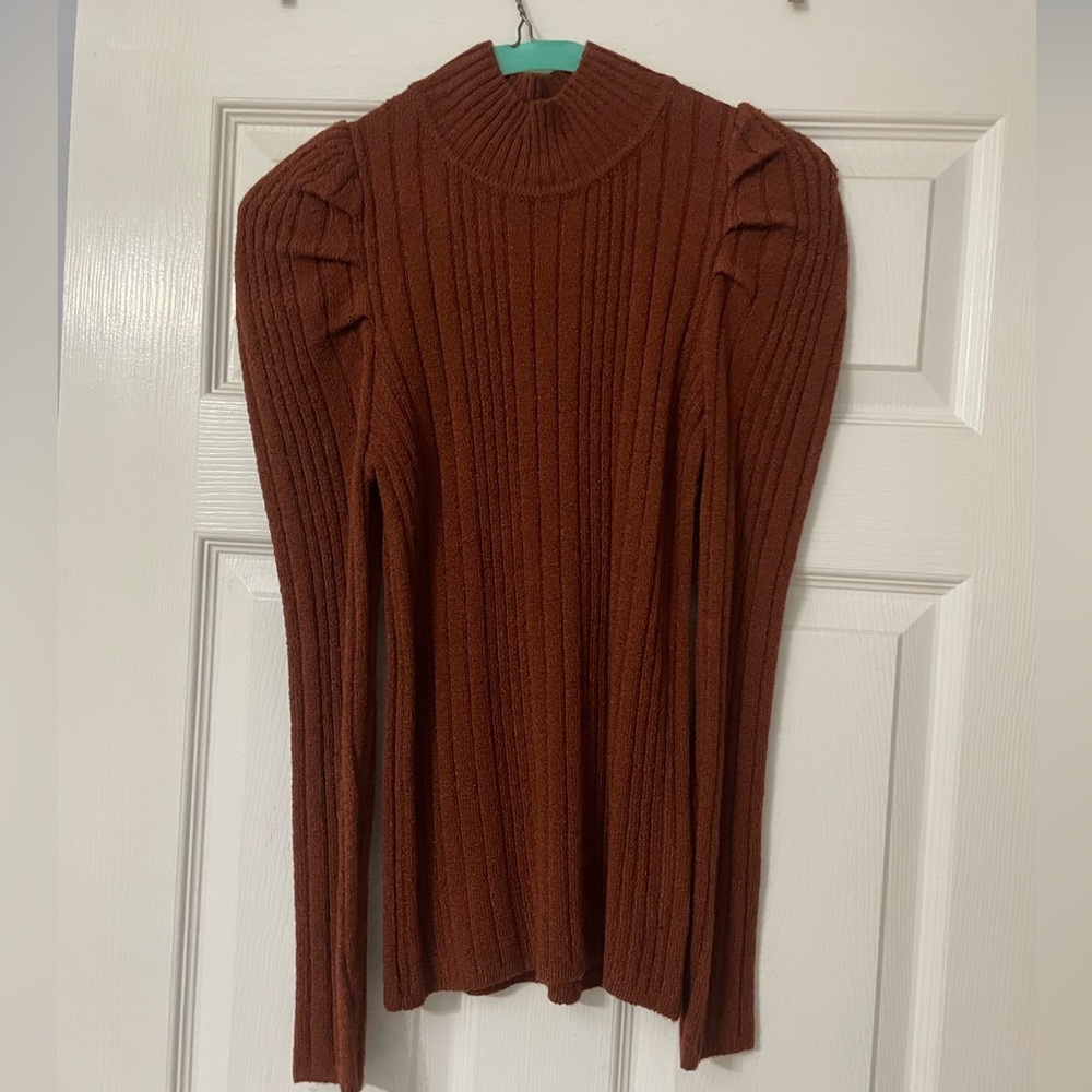 burnt orange long sleeve top w/ pleat detailing at shoulders
